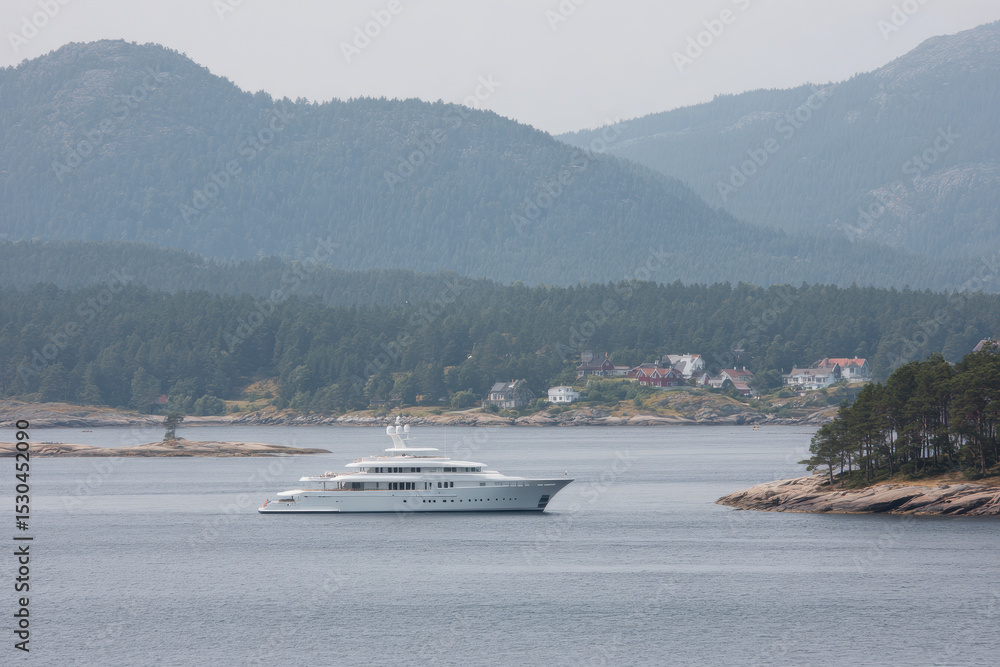 Obraz premium luxurious yacht floating serenely on calm waters surrounded by pristine natural landscape