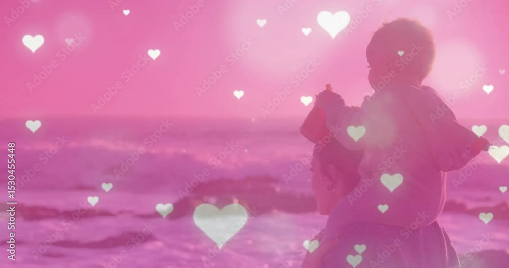Woman arriving water edge lifting baby on shoulders for health with hearts pulsing over ocean waves Woman arriving water edge lifting baby on shoulders for health with hearts pulsing over ocean waves
