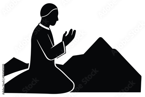 Silhouette of groom praying at mount arafat
