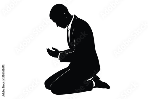Groom silhouetted kneeling in prayer on the ground