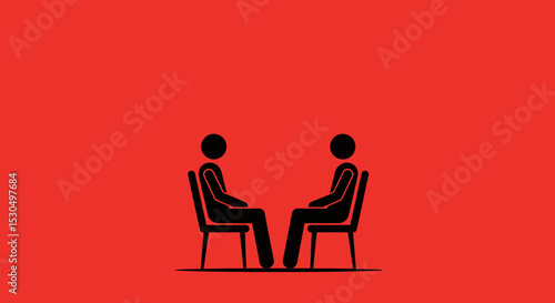 Two People Sitting in Chairs Facing Each Other
