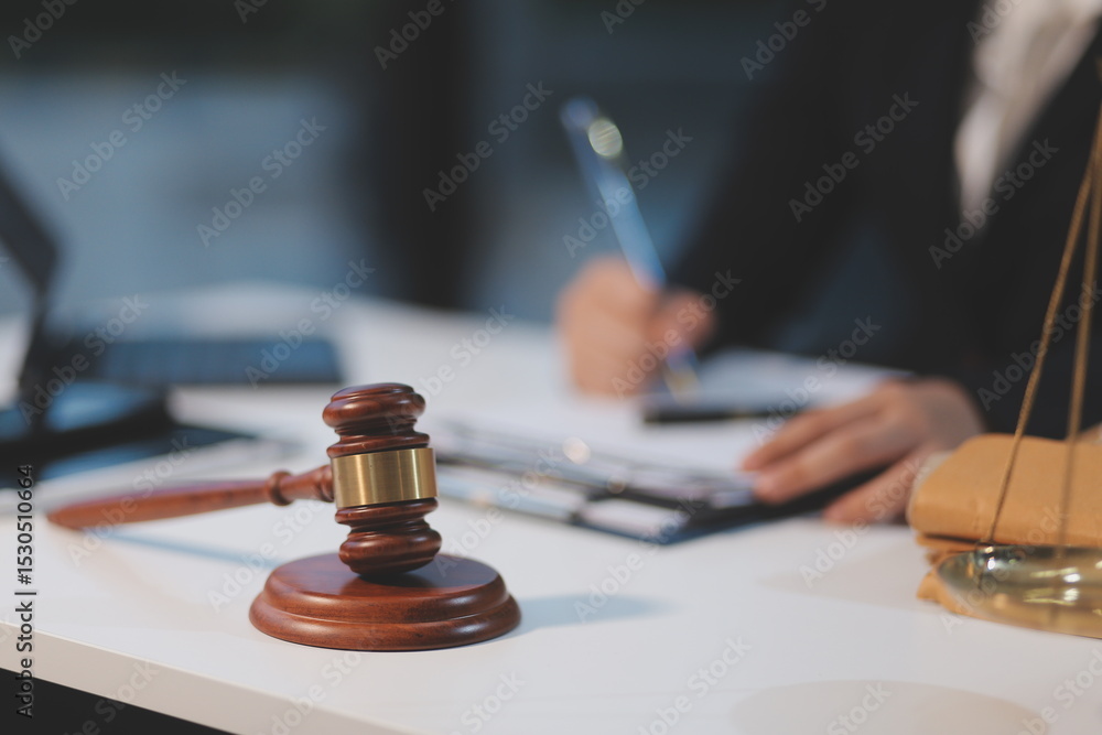 Judge gavel with Justice lawyers having team meeting at law firm background. Concepts of Law and Legal services. Judge gavel with Justice lawyers having team meeting at law firm background. Concepts of Law and Legal services.