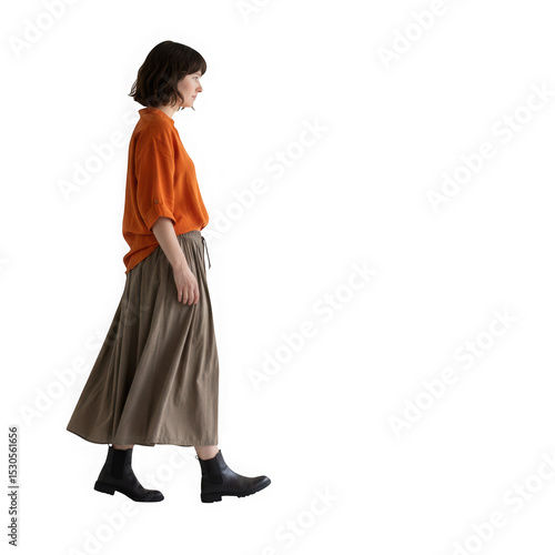 Woman walking in orange shirt and brown skirt isolated on transparent background