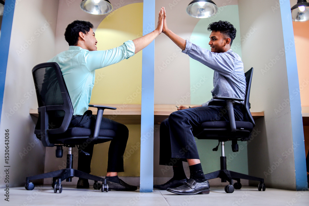 Fototapeta premium Two Coworkers Celebrating Success with High Five and Thanking Each Other for Partnership