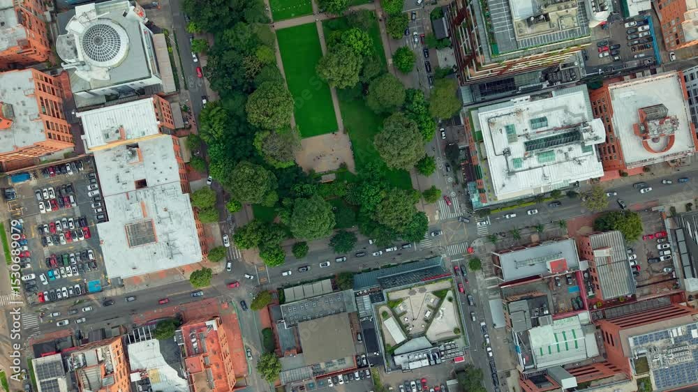 Aerial view captured by a drone of Bogotá, Colombia, with orange houses between tree-lined green streets Aerial view captured by a drone of Bogotá, Colombia, with orange houses between tree-lined green streets
