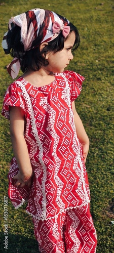 young girl in a red dress Pakistan