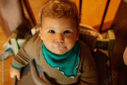 Adorable toddler with messy...