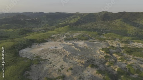Buzău's Boiling Mud Volcanoes.
This aerial video captures a surreal landscape in Buzău County, Romania, showcasing the unique and otherworldly Muddy Volcanoes. 