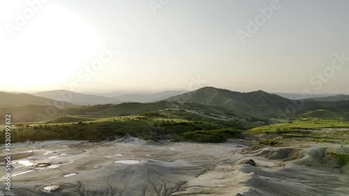 Buzău's Boiling Mud Volcanoes.
This aerial video captures a surreal landscape in Buzău County, Romania, showcasing the unique and otherworldly Muddy Volcanoes. 