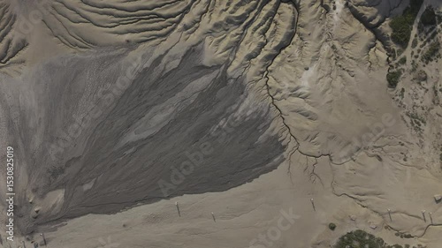 Buzău's Boiling Mud Volcanoes.
This aerial video captures a surreal landscape in Buzău County, Romania, showcasing the unique and otherworldly Muddy Volcanoes. 