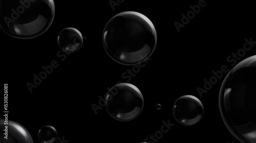 Black spheres rolling on a dark background