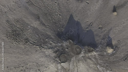 Buzău's Boiling Mud Volcanoes.
This aerial video captures a surreal landscape in Buzău County, Romania, showcasing the unique and otherworldly Muddy Volcanoes. 