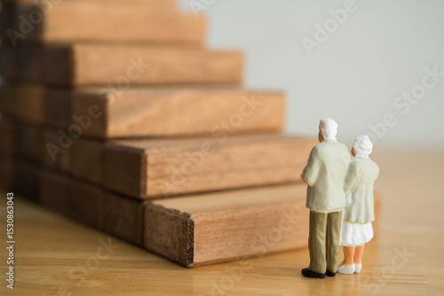 Photography Old senior couple looking at high staircase