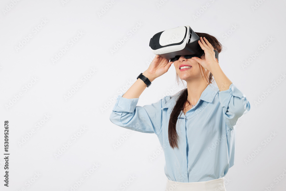 Young asian woman using vr headset for future game tech, teenage experience with virtual reality, much gesticulating hands and exploring cyberspace in vr, isolated studio white background Young asian woman using vr headset for future game tech, teenage experience with virtual reality, much gesticulating hands and exploring cyberspace in vr, isolated studio white background
