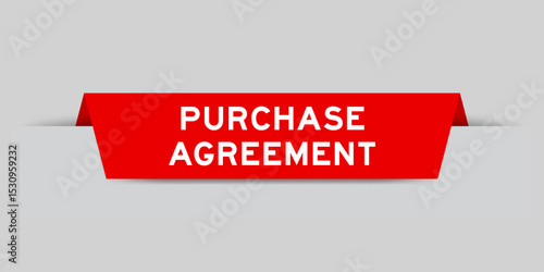 Red color inserted label with word purchase agreement on gray background