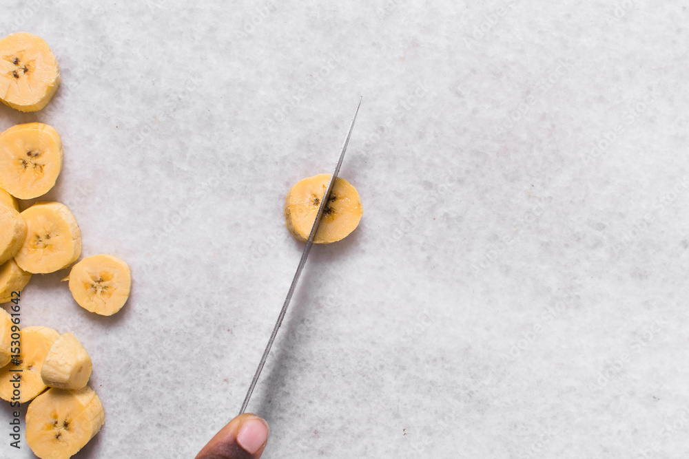 Top view of diced ripe plantains, dicing yellow plantains for frying, process for making fried plantain Top view of diced ripe plantains, dicing yellow plantains for frying, process for making fried plantain