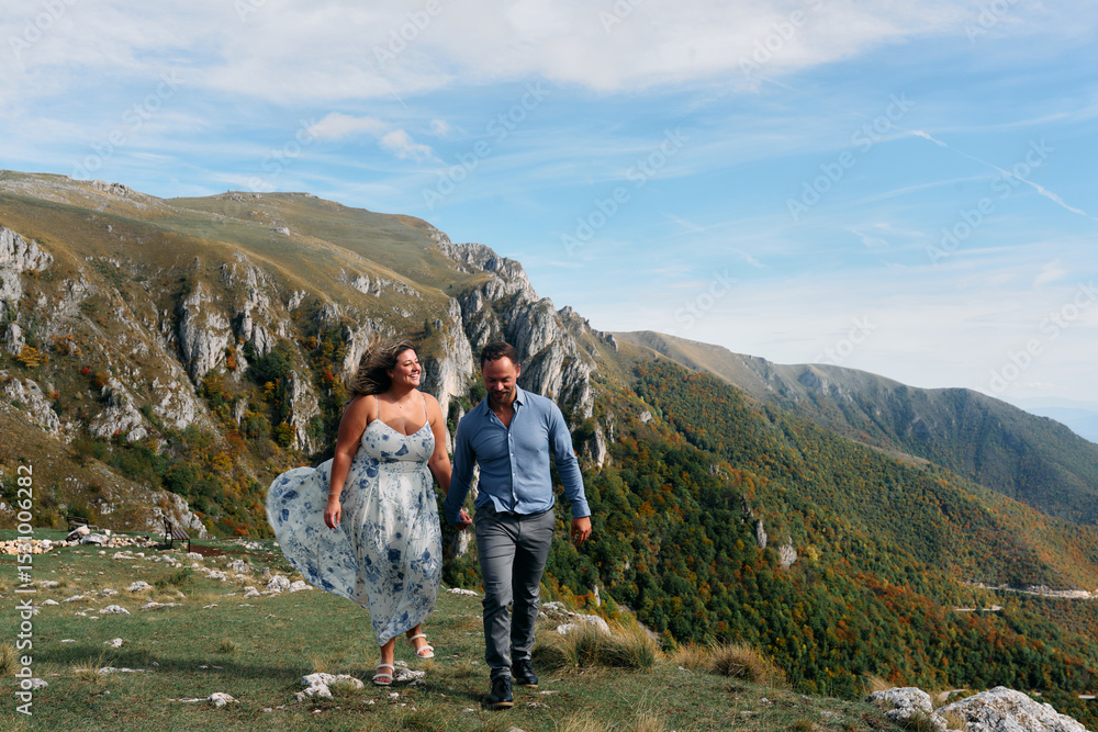 Fototapeta premium Couple walking together on mountain trail