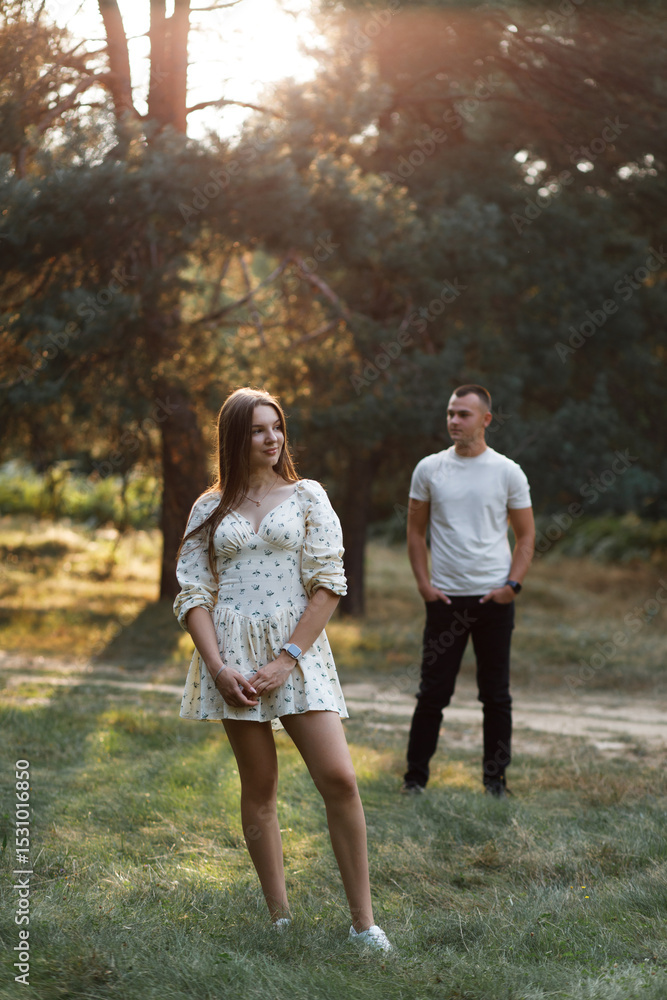 Couple in a pine forest in summer Couple in a pine forest in summer