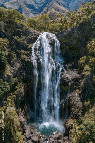 The Azores Islands in Portugal boast a waterfall set amidst a lush green landscape