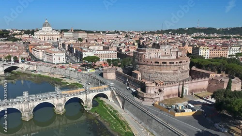 Aerial view of Rome showing the Tiber River winding through the city of ancient architecture. View of the city from above. Travelling through beautiful places of Rome. High quality footage in 4k forma