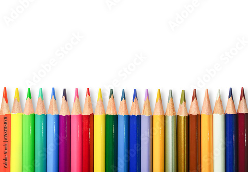 Isolated set of rainbow color wooden pencils. Multicolored bright background. Copy space for your text.