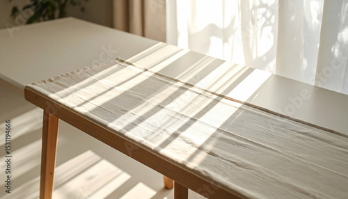 Off White Fabric on Wooden Table in Sunlit Room