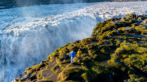 Canvas Print Witness breathtaking Dettifoss waterfall in Iceland, where travelers stand in awe of the powerful cascade
