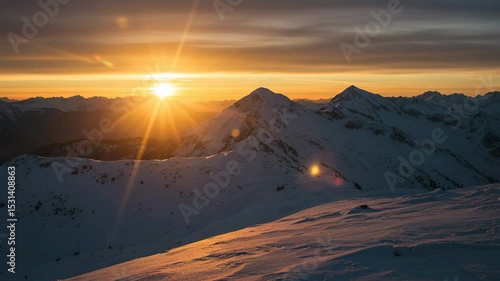 Snowy mountain landscape at sunset with warm light reflections  