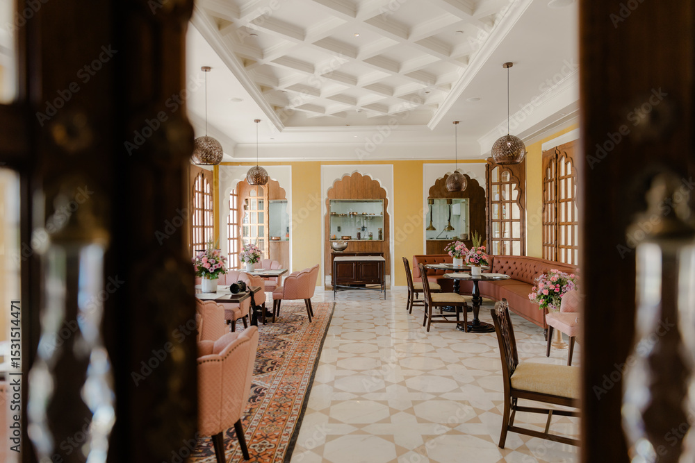 Obraz premium Interior of an upscale lounge area featuring soft lighting and comfortable seating arrangements, suggesting a relaxing and elegant atmosphere.