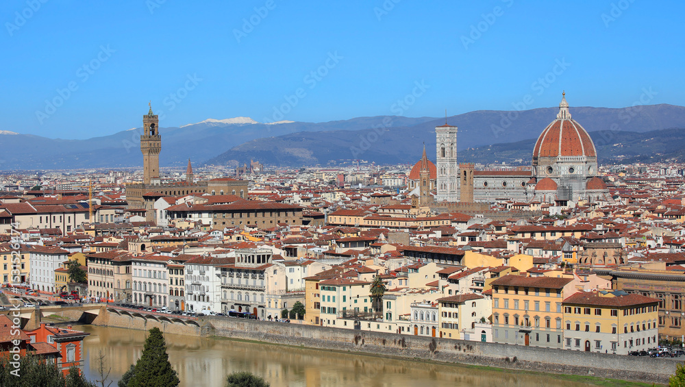 Fototapeta premium Wide view of Florence City in Central Italy with many famous landmarks like Tower of OLD Palace and the Dome of The Cathedral and Arno river