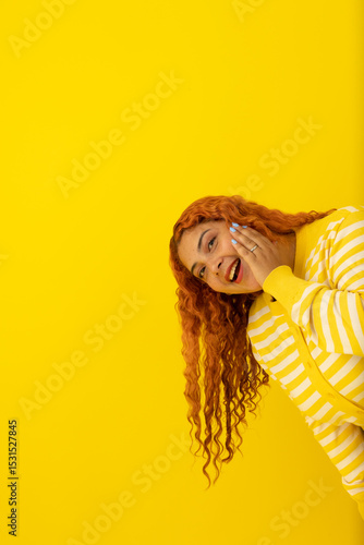 Canvas-taulu Vertical image of a freckled red haired woman wearing a yellow, white striped sh