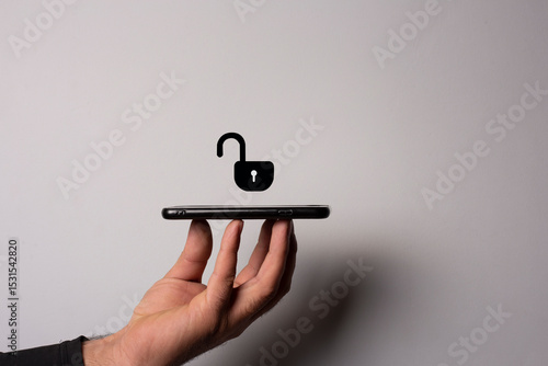 man holds smart phone with open lock