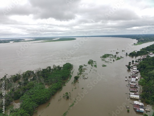 houses in an area flooded by the great flood of 2025 in the Amazon