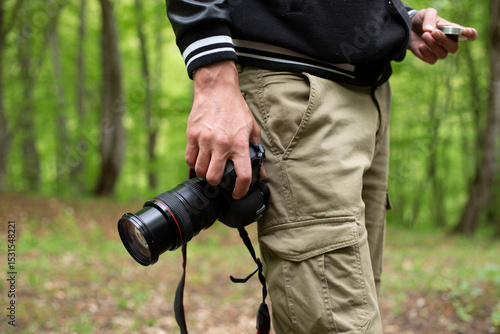 Close up, Yong man asian photographer holding digital camera