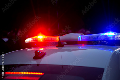 Police car lights at night city street. Red and blue lights.