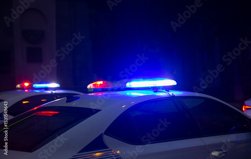 Police car lights at night city street. Red and blue lights.