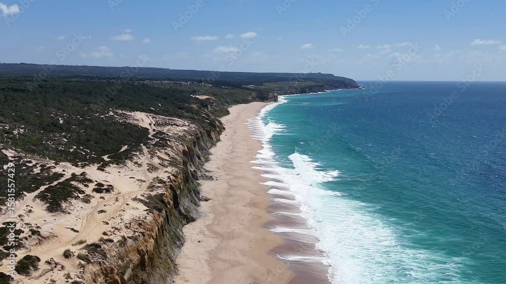 High drone view above golden coastal cliffs and turquoise ocean waters near Lisbon. Aerial scene showcasing vivid textures between rock, sand, and clear Atlantic waves in soft sunlight. High drone view above golden coastal cliffs and turquoise ocean waters near Lisbon. Aerial scene showcasing vivid textures between rock, sand, and clear Atlantic waves in soft sunlight.