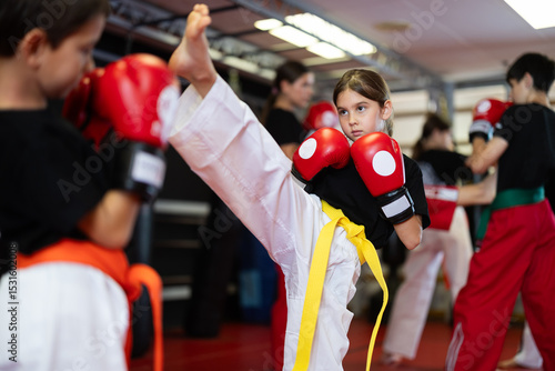 Konstfotografi Boy and a girl in red boxing gloves work in sparring, they practice punches and practice stance