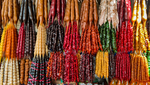 Georgian national dessert - churchkhela in assortment at the Georgian bazaar.
