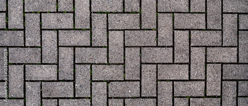 A brick wall with a pattern of squares and triangles