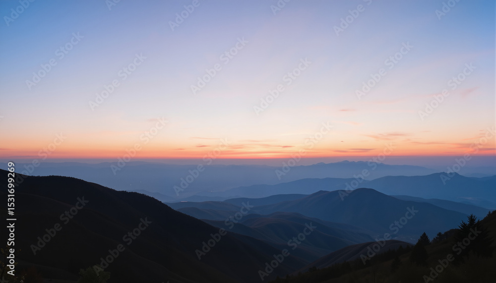 Obraz premium Mountain landscape at sunset with layers of hills