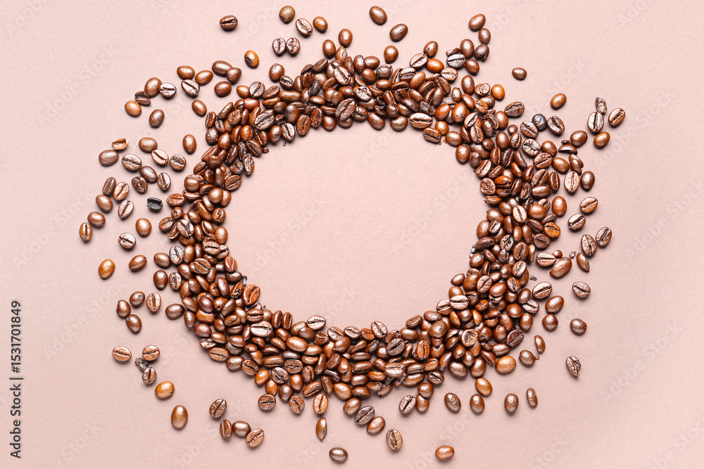 Obraz premium Frame made of coffee beans on beige background