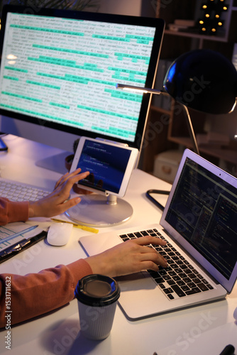 Female programmer working w...