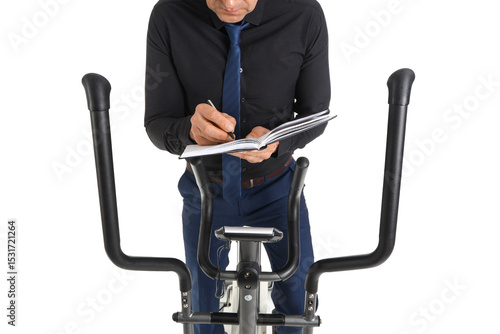 Mature businessman writing ...