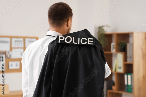 Male police officer in offi...