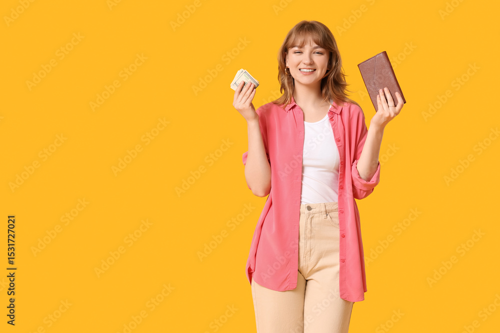 Beautiful young woman holding wallet and money on yellow background Beautiful young woman holding wallet and money on yellow background