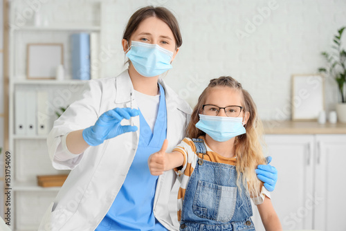 Female doctor with vaccine ...