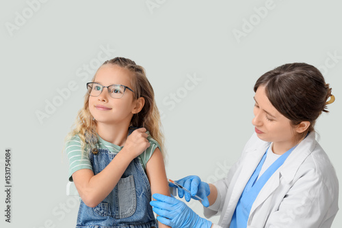 Little girl receiving vacci...