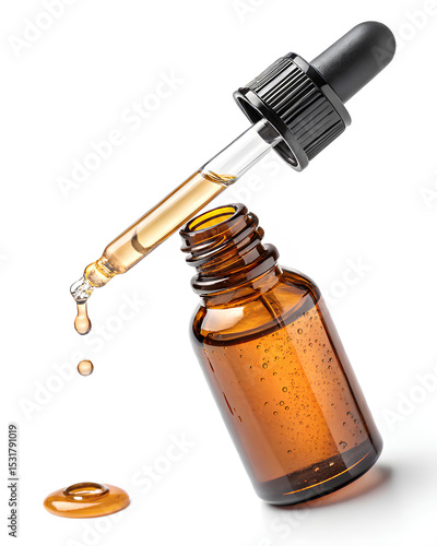 Glass amber dropper bottle dispensing oil, commonly used for essential oils, skincare serums, or natural remedies on white background.
