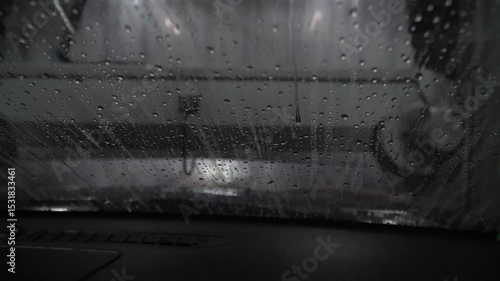 Car going through an automated car wash machine,automatic car washing machine.